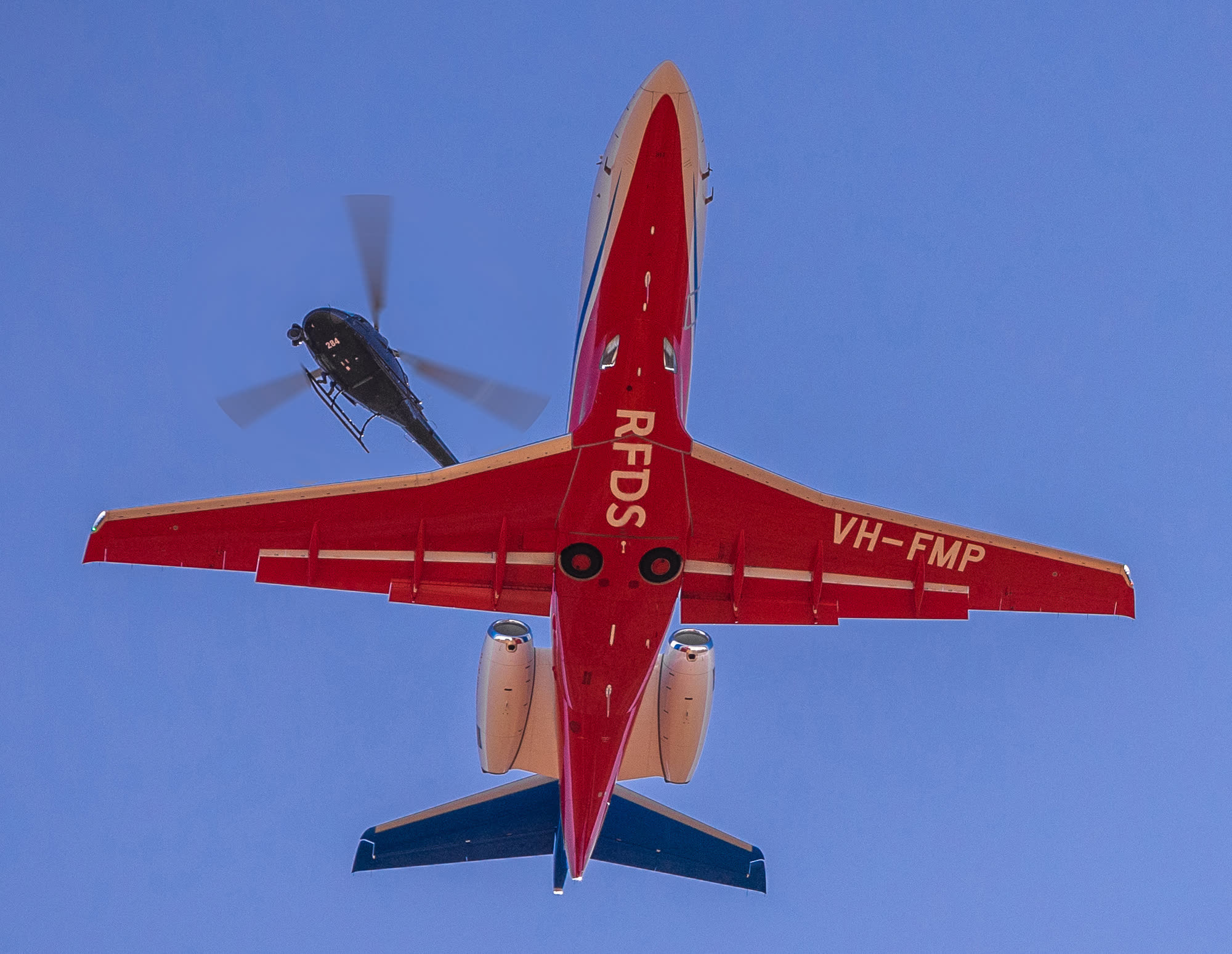 Air-to-air photography of a Royal Flying Doctor Service aircraft in flight